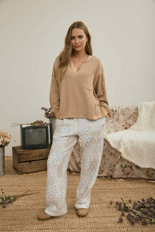 SPLIT NECK RAW EDGE LONG SLEEVE RIBBED KNIT TOP