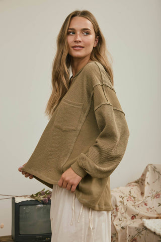 SPLIT NECK RAW EDGE LONG SLEEVE RIBBED KNIT TOP