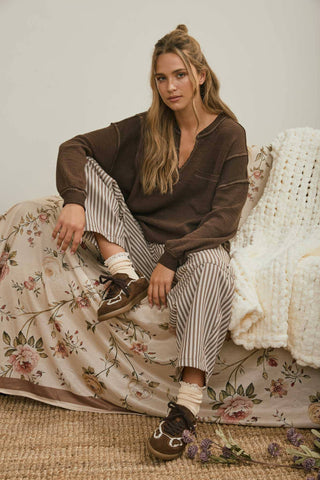 SPLIT NECK RAW EDGE LONG SLEEVE RIBBED KNIT TOP