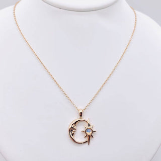 Gold plated necklace with a hollow crescent moon and star pendant set with an opal, view 2