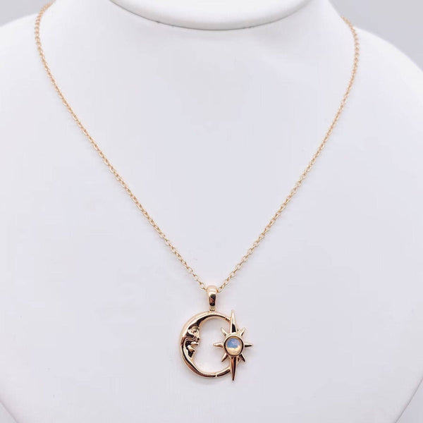 Gold plated necklace with a hollow crescent moon and star pendant set with an opal, view 2