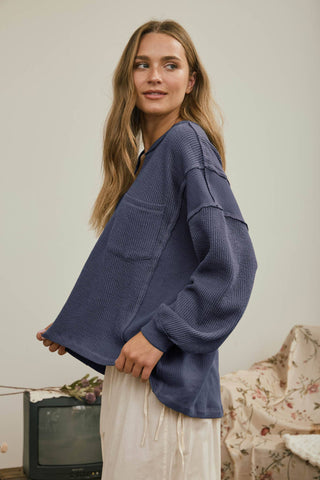 SPLIT NECK RAW EDGE LONG SLEEVE RIBBED KNIT TOP
