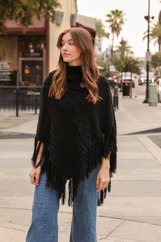 Turtleneck Cable Knit Poncho With Tassels