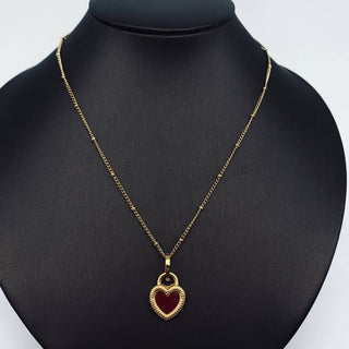 Gold plated stainless steel necklace with a two-sided enamel heart pendant, black on one side, pink on the other, view 5