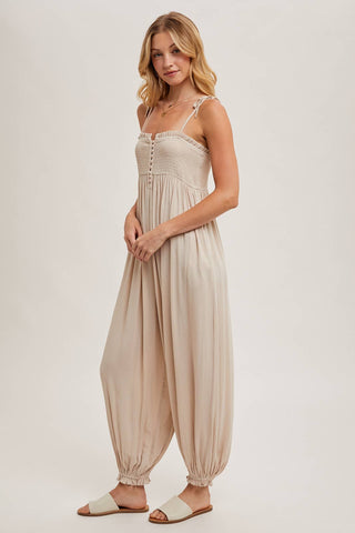 GAUZE SMOCKED BUTTON FRONT SHOULDER TIE JUMPSUIT