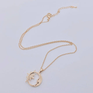Gold plated necklace with a hollow crescent moon and star pendant set with an opal, view 3