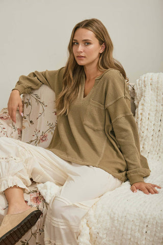 SPLIT NECK RAW EDGE LONG SLEEVE RIBBED KNIT TOP
